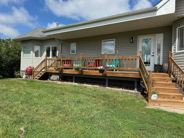 48285 229th Ave, Clearbrook, MN 56634 - back of house with a yard, a wooden deck, and a shingled roof