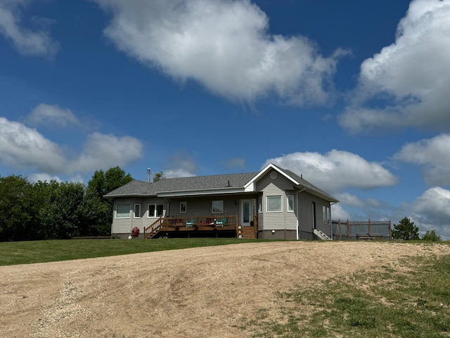 48285 229th Ave, Clearbrook, MN 56634 - rear view of property featuring a wooden deck, crawl space, and a lawn
