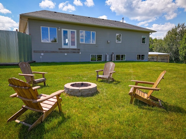 48285 229th Ave, Clearbrook, MN 56634 - rear view of property with an outdoor fire pit and a yard