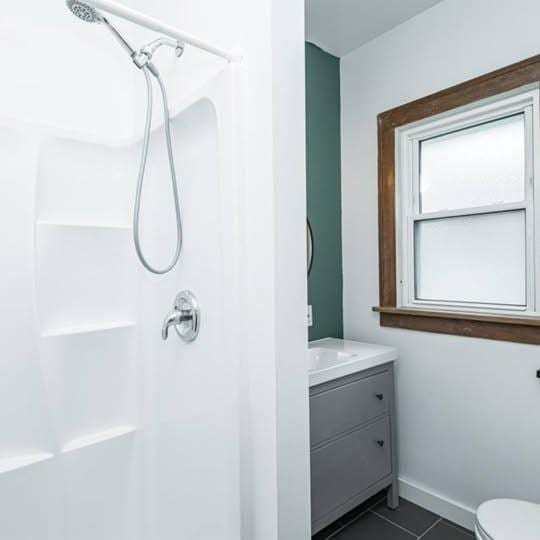 20 12th St NE, Rochester, MN 55906 - full bathroom with a shower, tile patterned flooring, and vanity