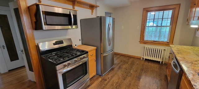 5015 17th Ave S, Minneapolis, MN 55417 - kitchen featuring stainless steel appliances, radiator, dark wood finished floors, and butcher block countertops