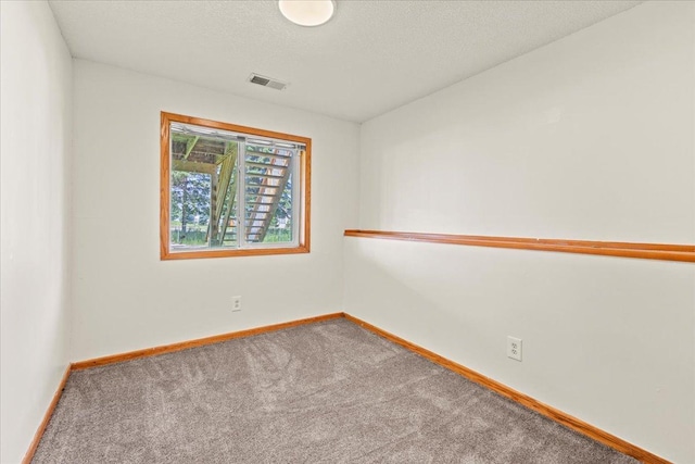 3455 Kahler Dr NE, Saint Michael, MN 55376 - carpeted spare room featuring baseboards and a textured ceiling