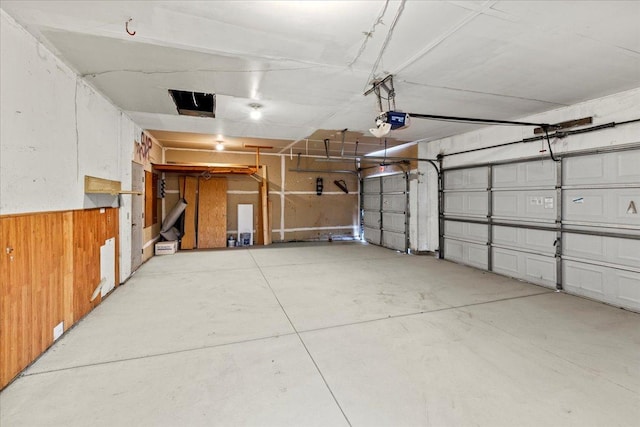3455 Kahler Dr NE, Saint Michael, MN 55376 - garage with a garage door opener and wood walls