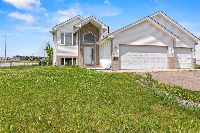 3455 Kahler Dr NE, Saint Michael, MN 55376 - tri-level home featuring brick siding, an attached garage, and driveway