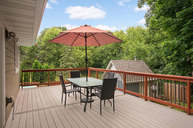 11735 52nd Ave N, Plymouth, MN 55442 - wooden deck with outdoor dining area and an outbuilding