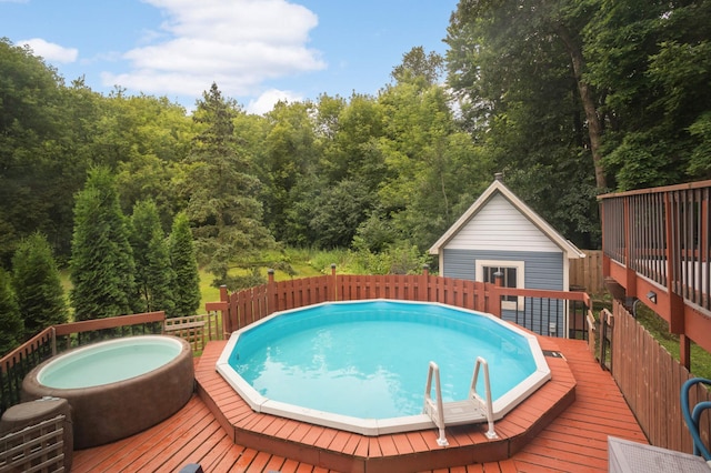11735 52nd Ave N, Plymouth, MN 55442 - view of swimming pool with a deck, an outdoor structure, a wooded view, and a hot tub