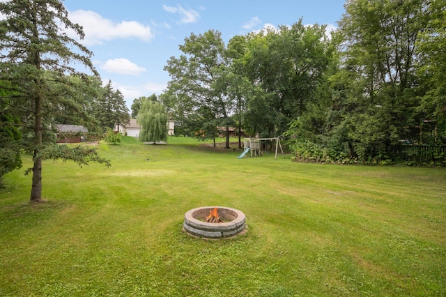 11735 52nd Ave N, Plymouth, MN 55442 - view of green lawn with a fire pit and a playground