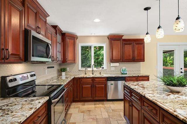11735 52nd Ave N, Plymouth, MN 55442 - kitchen with stainless steel appliances, backsplash, pendant lighting, light stone counters, and recessed lighting