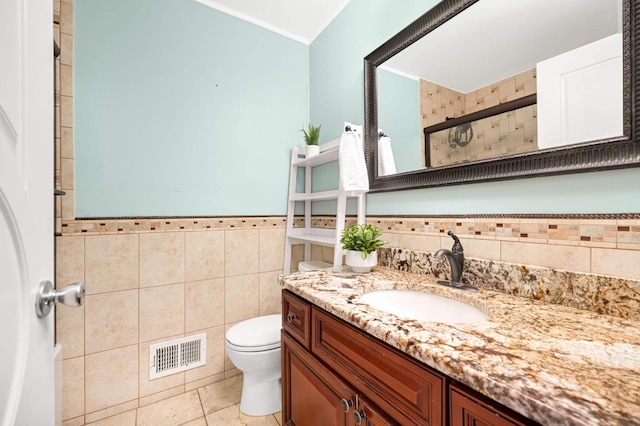 11735 52nd Ave N, Plymouth, MN 55442 - full bathroom featuring tile walls, vanity, tiled shower, a wainscoted wall, and tile patterned flooring