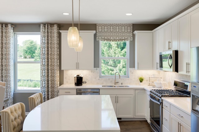 14620 106th Pl N, Maple Grove, MN 55369 - kitchen featuring stainless steel appliances, light countertops, white cabinets, decorative backsplash, and recessed lighting