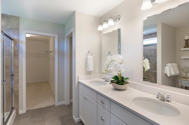 14620 106th Pl N, Maple Grove, MN 55369 - full bathroom with a shower stall, double vanity, a spacious closet, and tile patterned flooring