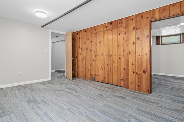 4405 6th St NE, Columbia Heights, MN 55421 - spare room featuring wooden walls and carpet flooring