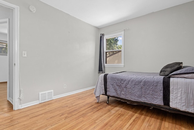 4405 6th St NE, Columbia Heights, MN 55421 - bedroom featuring light wood-style floors and lofted ceiling