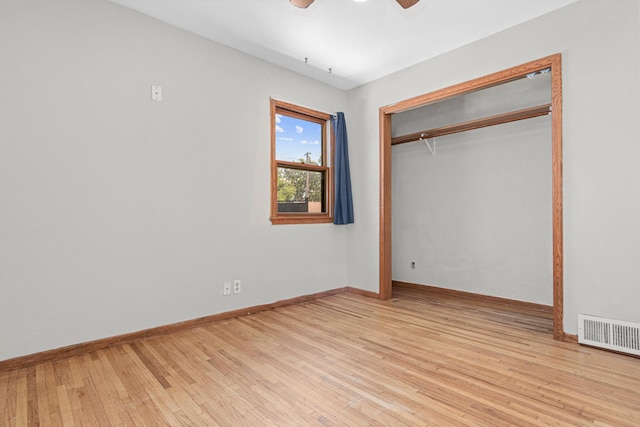 4405 6th St NE, Columbia Heights, MN 55421 - unfurnished bedroom with wood finished floors, a closet, and a ceiling fan