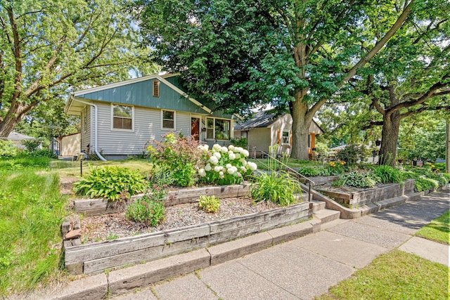 4405 6th St NE, Columbia Heights, MN 55421 - view of front of property featuring a vegetable garden