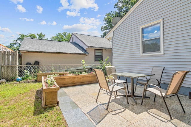 4405 6th St NE, Columbia Heights, MN 55421 - view of patio / terrace featuring a vegetable garden and outdoor dining space