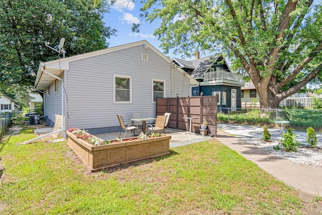 4405 6th St NE, Columbia Heights, MN 55421 - rear view of house featuring a patio