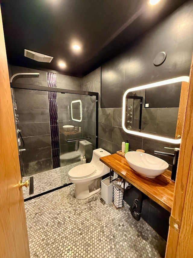 14303 Utica Ave, Savage, MN 55378 - full bathroom featuring tile walls and a stall shower