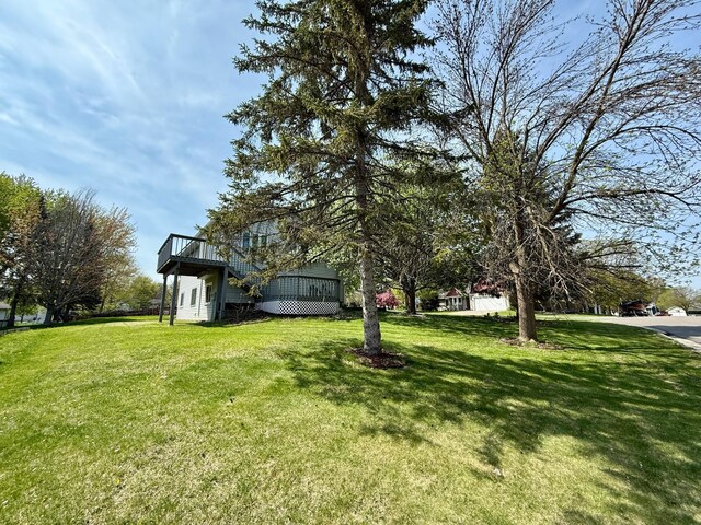 14303 Utica Ave, Savage, MN 55378 - view of grassy yard with a wooden deck