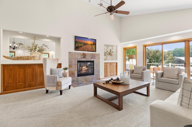 1701 Baywood Ln, Mound, MN 55364 - living area featuring a high ceiling, a fireplace, ceiling fan, and light colored carpet