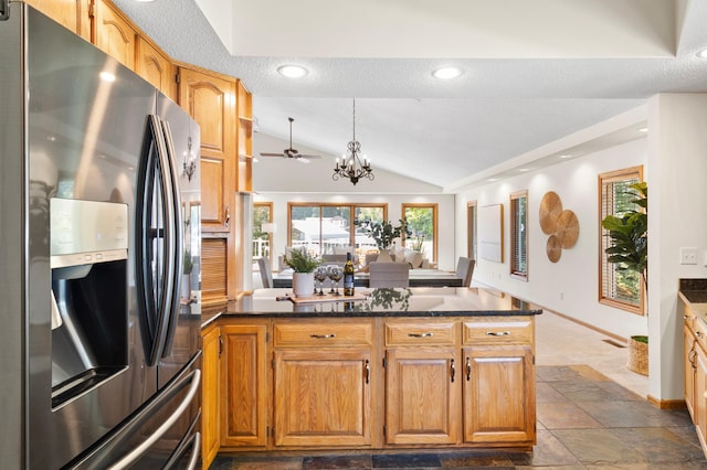 1701 Baywood Ln, Mound, MN 55364 - kitchen with stainless steel fridge with ice dispenser, vaulted ceiling, a chandelier, dark stone finish floors, and a ceiling fan