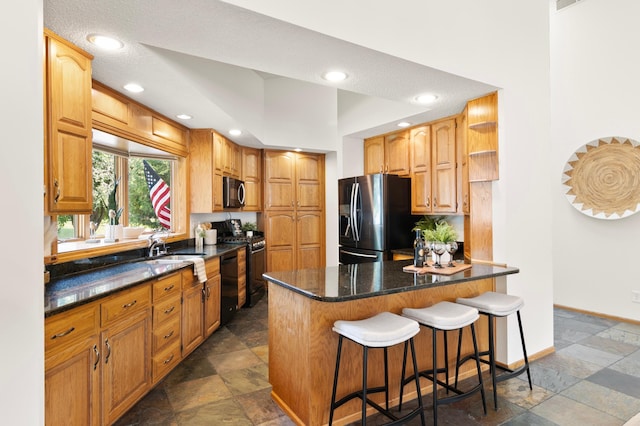 1701 Baywood Ln, Mound, MN 55364 - kitchen with stainless steel fridge with ice dispenser, black dishwasher, stone tile flooring, a kitchen breakfast bar, and stove