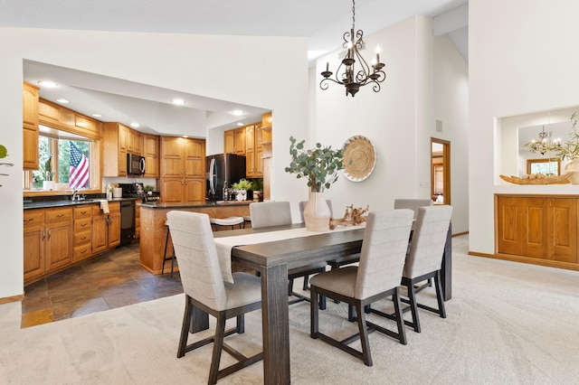 1701 Baywood Ln, Mound, MN 55364 - dining room with a chandelier, high vaulted ceiling, and light carpet