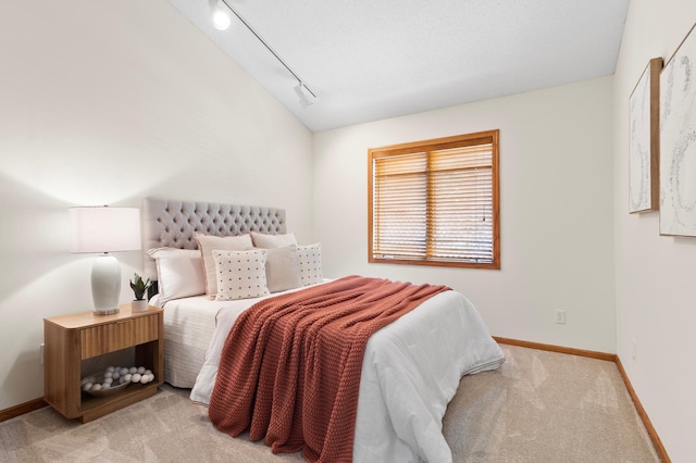 1701 Baywood Ln, Mound, MN 55364 - bedroom with light colored carpet, rail lighting, and vaulted ceiling