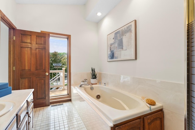 1701 Baywood Ln, Mound, MN 55364 - full bath featuring a whirlpool tub, tile patterned flooring, vanity, and recessed lighting