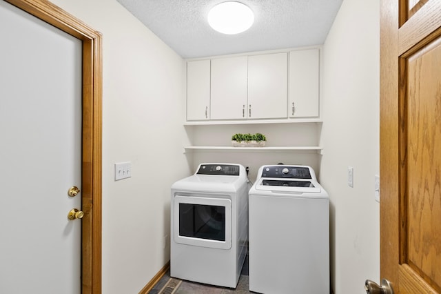 1701 Baywood Ln, Mound, MN 55364 - laundry room with separate washer and dryer, cabinet space, and a textured ceiling