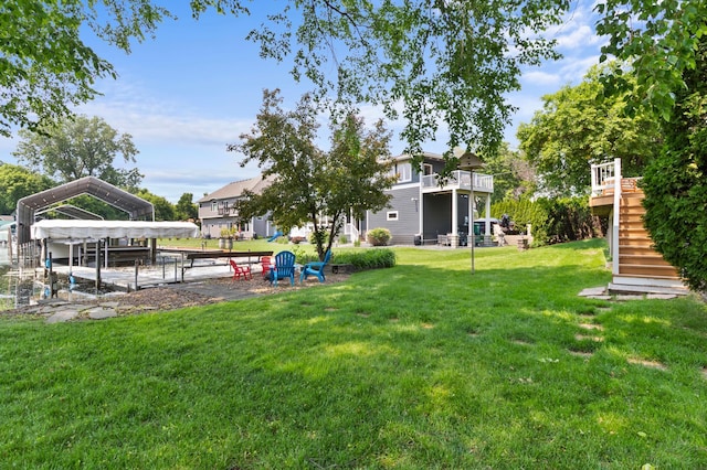 1701 Baywood Ln, Mound, MN 55364 - view of green lawn with stairway and a detached carport