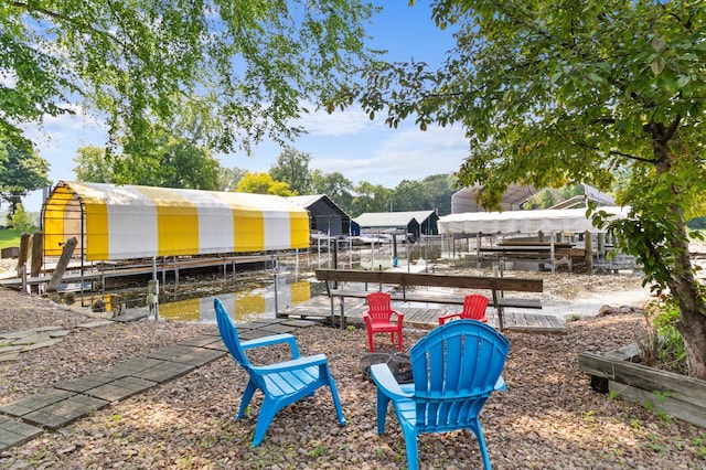 1701 Baywood Ln, Mound, MN 55364 - view of yard featuring boat lift, a boat dock, and a fire pit