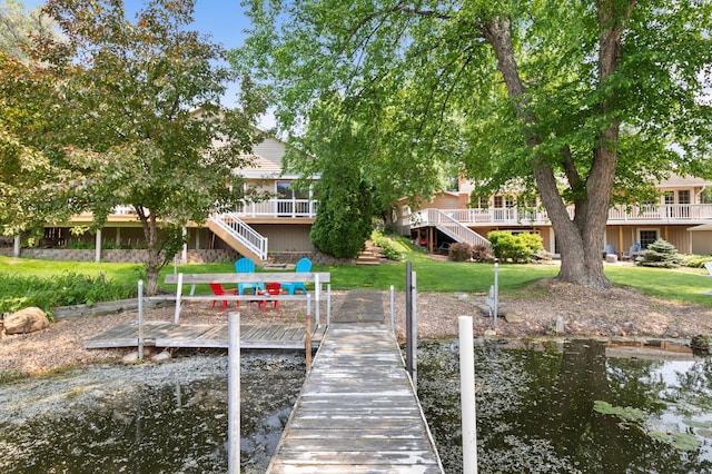 1701 Baywood Ln, Mound, MN 55364 - dock area featuring stairway, a yard, and a deck with water view