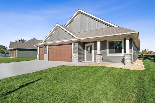 4786 384th St, North Branch, MN 55056 - craftsman-style home featuring a garage, a front lawn, stone siding, and concrete driveway