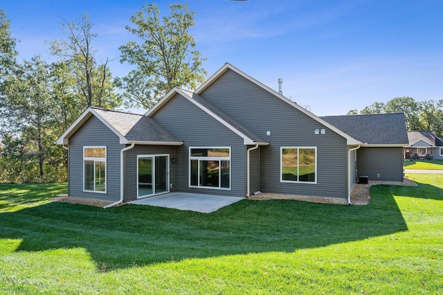 4786 384th St, North Branch, MN 55056 - back of house featuring a yard, a patio, and a shingled roof
