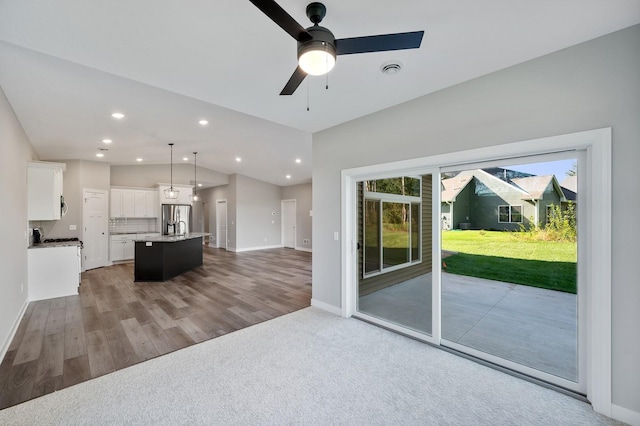 4786 384th St, North Branch, MN 55056 - unfurnished living room with lofted ceiling, recessed lighting, ceiling fan, and wood finished floors