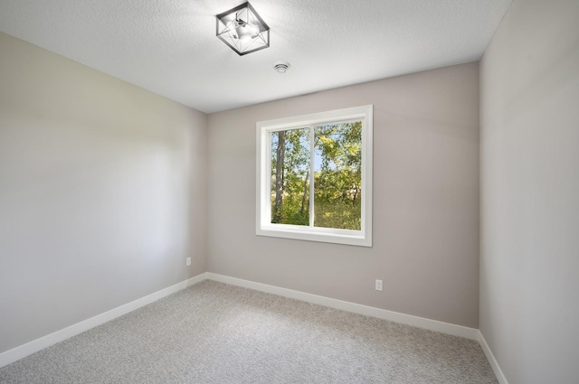4786 384th St, North Branch, MN 55056 - carpeted spare room with a textured ceiling and a smoke detector