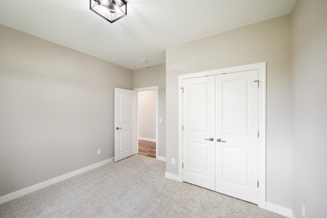 4786 384th St, North Branch, MN 55056 - unfurnished bedroom featuring carpet, a closet, and a textured ceiling