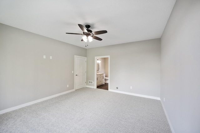 4786 384th St, North Branch, MN 55056 - spare room with a ceiling fan and dark carpet