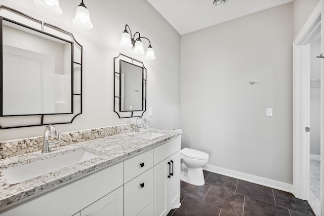 4786 384th St, North Branch, MN 55056 - bathroom featuring double vanity, tile patterned floors, and a spacious closet
