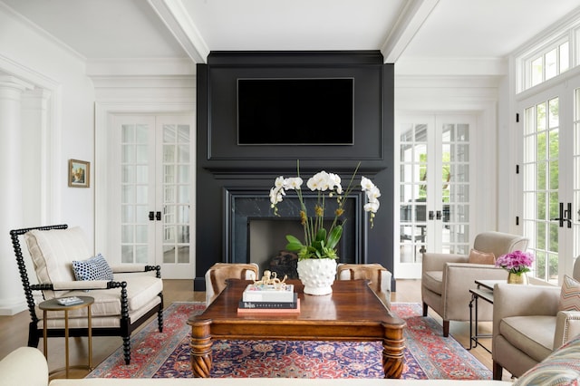 14XX Fox St, Wayzata, MN 55391 - living area featuring french doors, ornamental molding, wood finished floors, beamed ceiling, and a high end fireplace