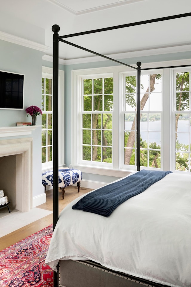 14XX Fox St, Wayzata, MN 55391 - bedroom featuring crown molding, a water view, and wood finished floors