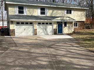 3665 Oakgreen Ave N, Baytown Twp, MN 55082 - traditional-style house with concrete driveway and an attached garage