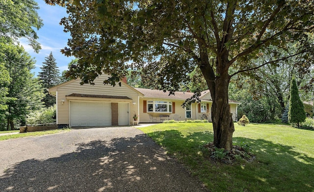1682 Oakdale Ave W, Saint Paul, MN 55118 - view of front of home with an attached garage, driveway, and a front lawn