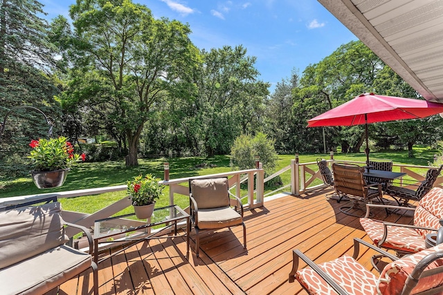1682 Oakdale Ave W, Saint Paul, MN 55118 - deck with outdoor dining area, view of scattered trees, and a yard