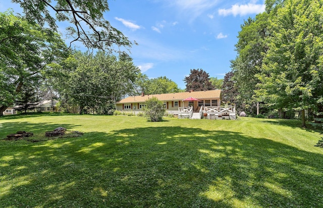 1682 Oakdale Ave W, Saint Paul, MN 55118 - view of green lawn with a wooden deck