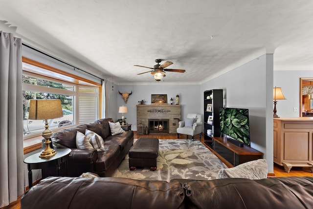 1682 Oakdale Ave W, Saint Paul, MN 55118 - living room featuring a ceiling fan, wood finished floors, and a brick fireplace