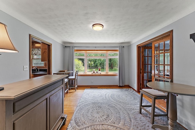 1682 Oakdale Ave W, Saint Paul, MN 55118 - home office featuring light wood-type flooring and a textured ceiling