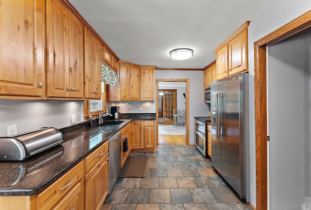 1682 Oakdale Ave W, Saint Paul, MN 55118 - kitchen featuring stainless steel appliances, stone finish flooring, and dark stone counters