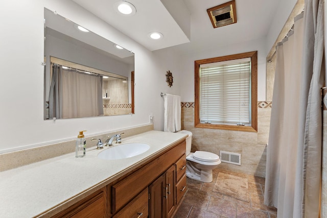 1682 Oakdale Ave W, Saint Paul, MN 55118 - bathroom with tile walls, vanity, curtained shower, recessed lighting, and a wainscoted wall